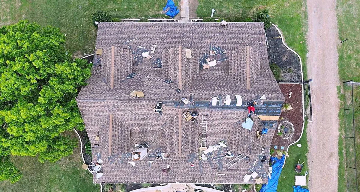 The crew working on a roof, seen from above