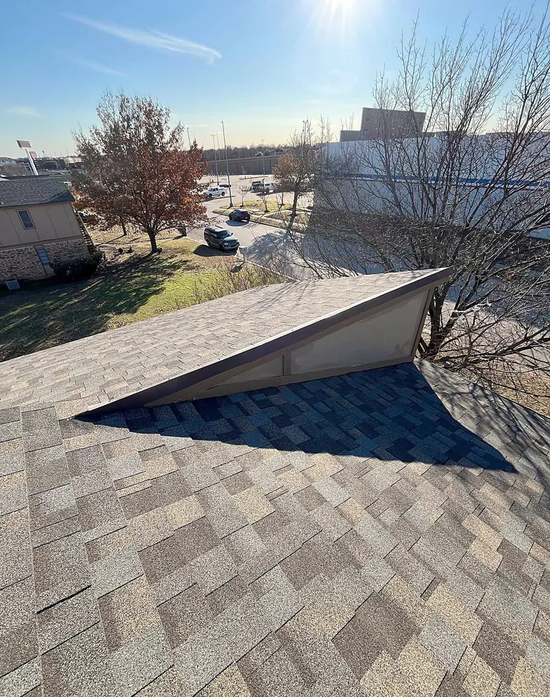New shingles around a small gable, seen from on the roof